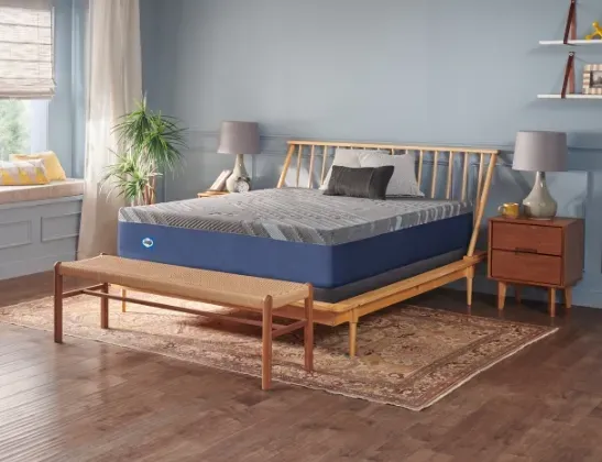 golden elegance mattress placed on wooden bed stand